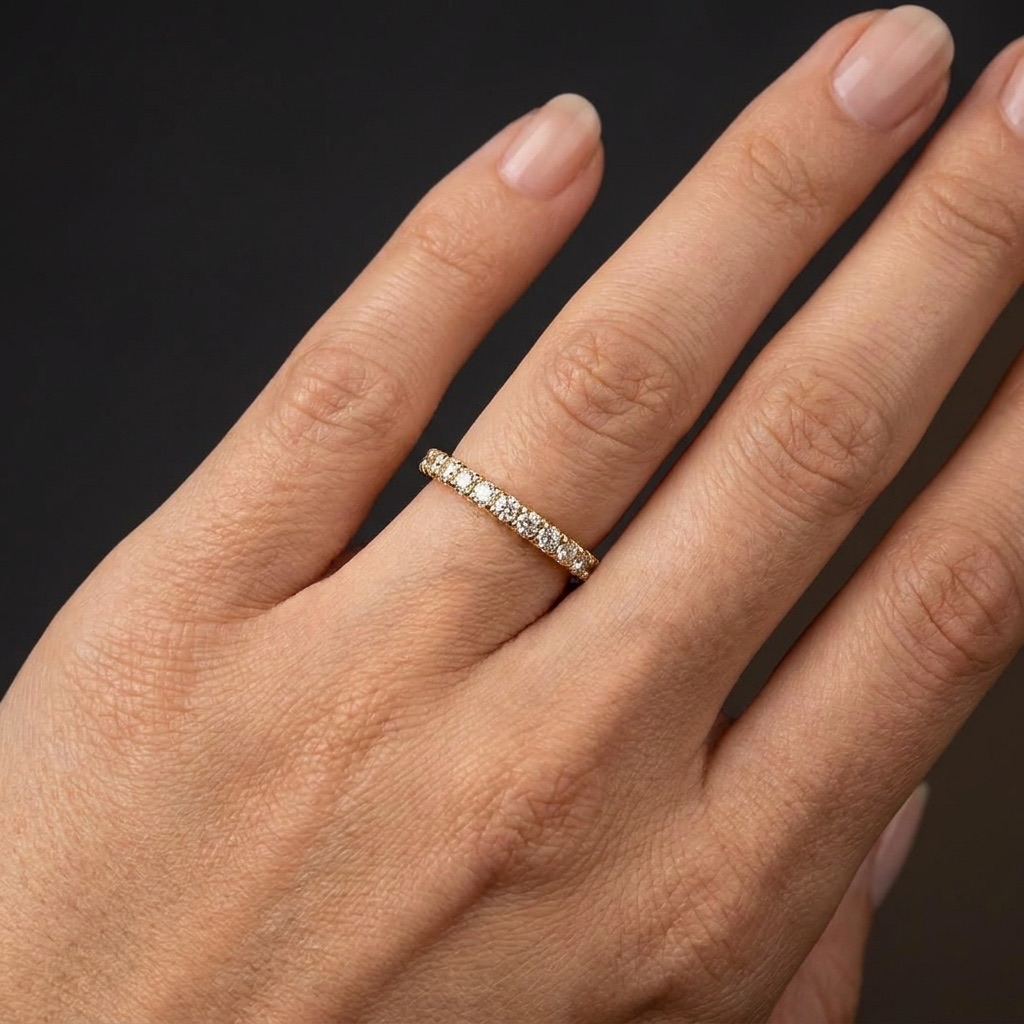 Diamond eternity band worn on the hand