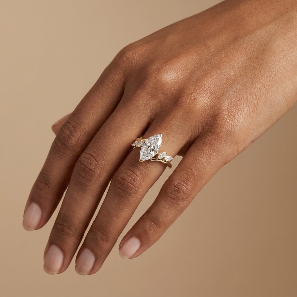 Pear-cut diamond engagement ring with side stones