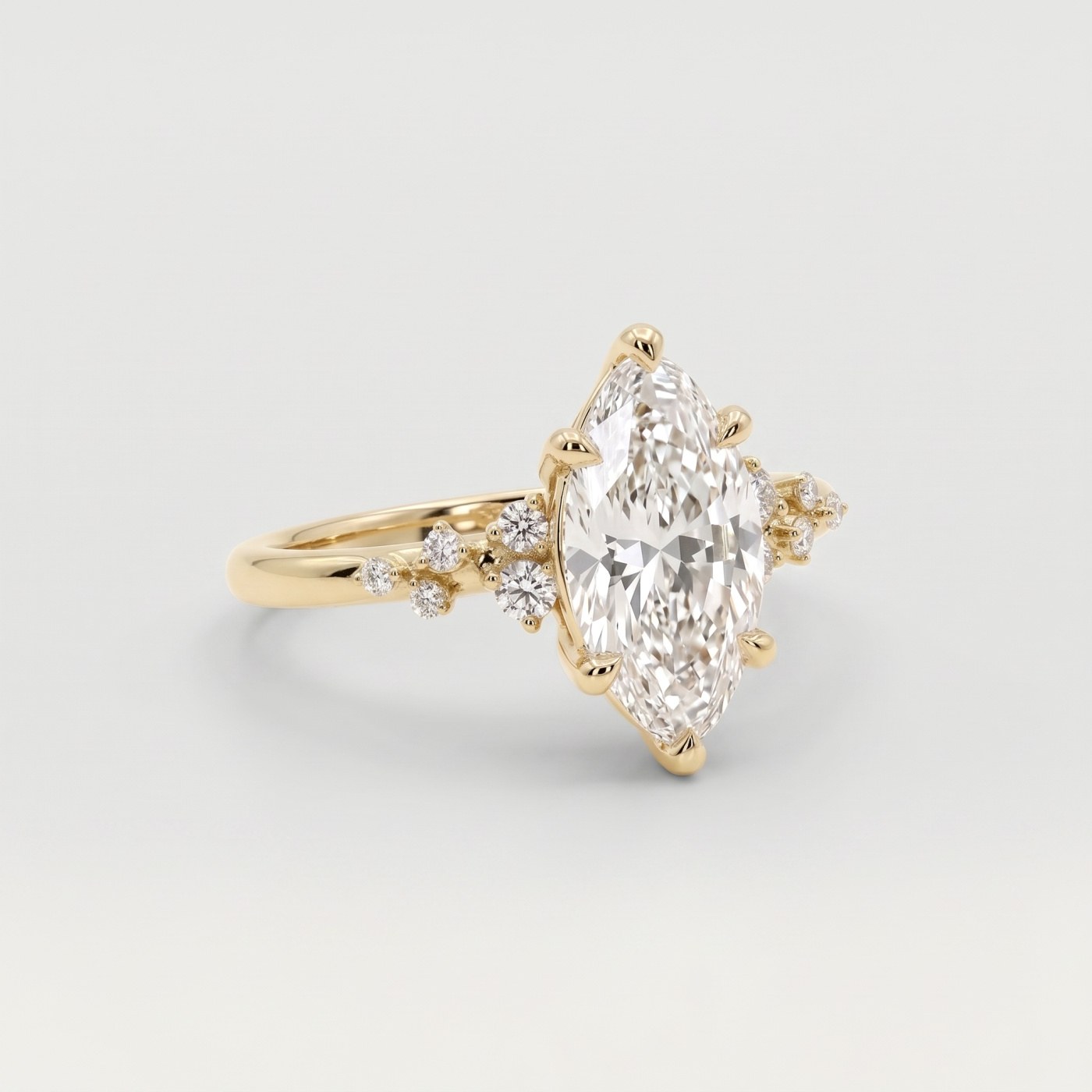 Yellow gold marquise diamond engagement ring with diamond cluster shoulders